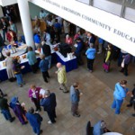 Maine beekeepers enjoy socializing, snacking, perusing raffle items and sampling honey contest entries in USM’s Abromson Center lobby.