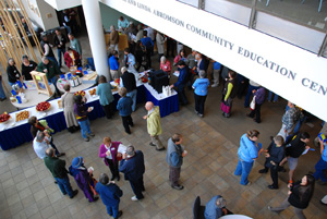 msba-annual-meeting-october-2011 Maine beekeepers enjoy socializing, snacking, perusing raffle items and sampling honey contest entries in USM’s Abromson Center lobby.