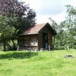 Swiss beekeepers' hives are kept inside a trailer or house -sometimes simple, sometimes rather elaborate