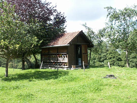 Swiss beekeepers' hives are kept inside a trailer or house -sometimes simple, sometimes rather elaborate Swiss beekeepers' hives are kept inside a trailer or house -sometimes simple, sometimes rather elaborate