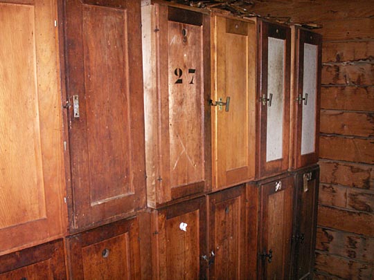 The bee boxes are tall and narrow, each accessible from the inside by its own door. The bees are cozied-up for colder months with insulating blankets wrapped around the vacant areas in these file-cabinet-styled hive enclosures. The bee boxes are tall and narrow, each accessible from the inside by its own door. The bees are cozied-up for colder months with insulating blankets wrapped around the vacant areas in these file-cabinet-styled hive enclosures.