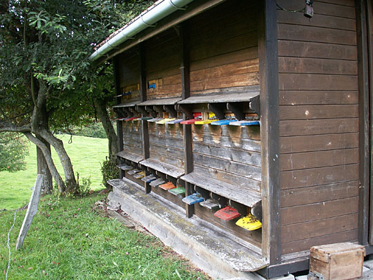 The bee entrances, all on one side of the structure, are typically painted different bright colors for easier bee recognition. The bee entrances, all on one side of the structure, are typically painted different bright colors for easier bee recognition.