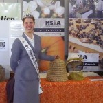 2011 American Honey Princess Allison Adams helps the WMBA ambassador beekeeping at the Fryeburg Fair.