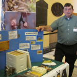 Charlie Merrill mans the informative MSBA display at Ag Day at the Legislature on March 27, 2013
