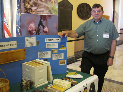 Charlie Merrill mans the informative MSBA display at Ag Day at the Legislature on March 27, 2013