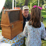 Leroy Cronkhite Sr. sharing and observation hive at the Farmington Fair